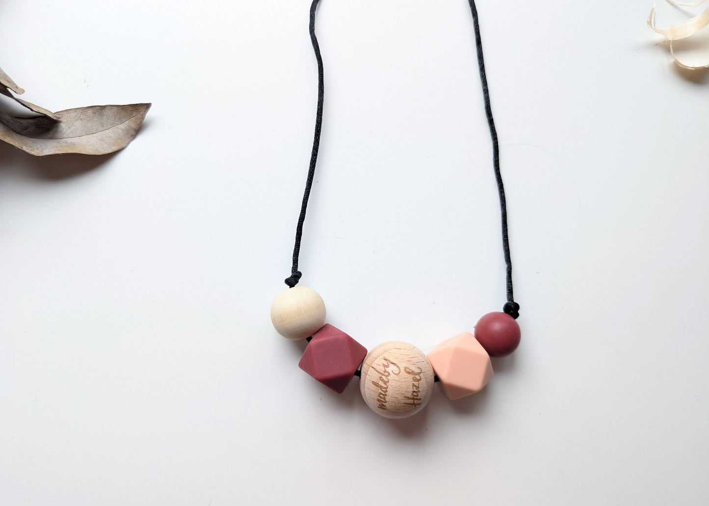 Mauve and peach nursing necklace for moms and babies