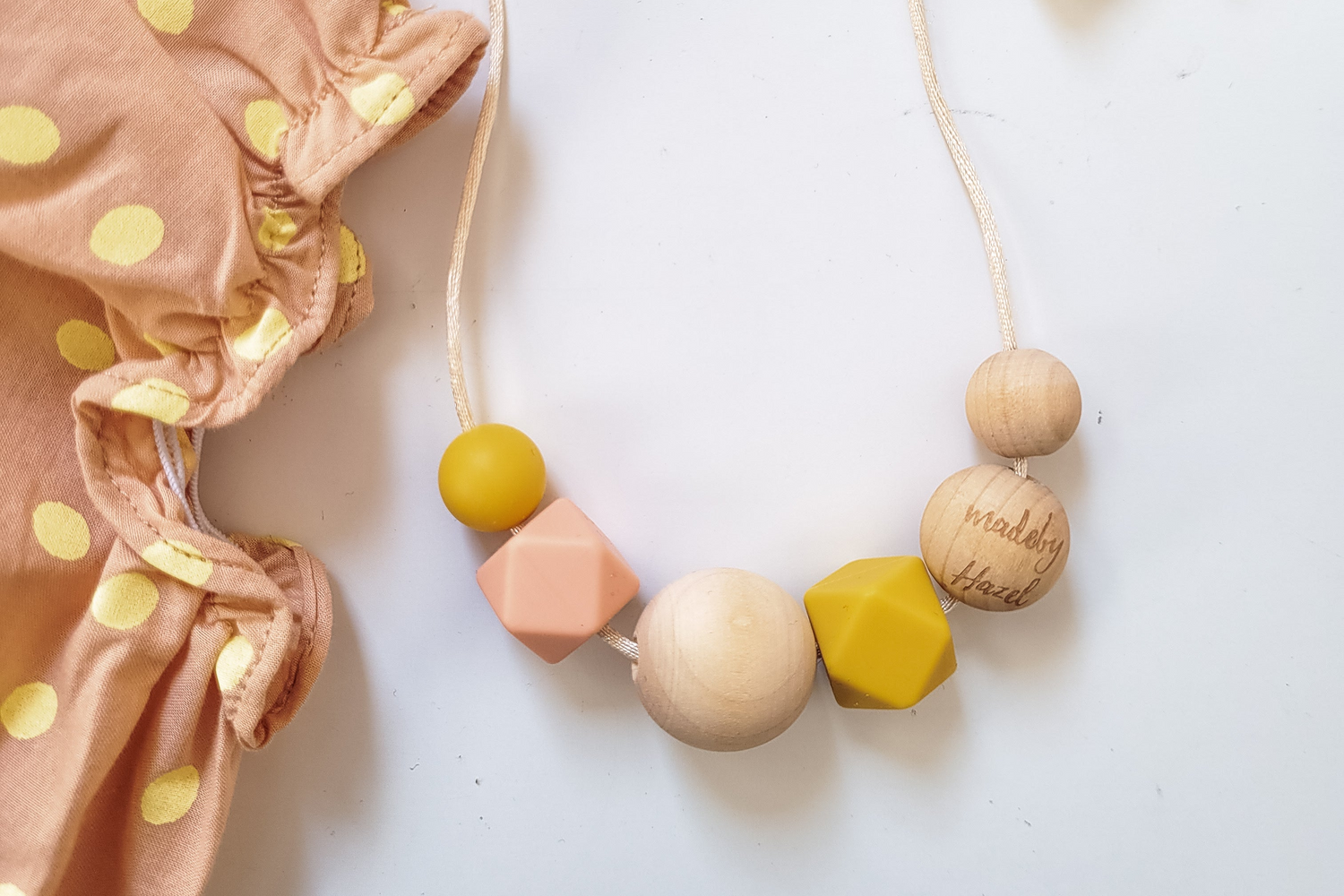 Cute Pink & Yellow nursing necklace in non-toxic wood & silicone beads from madebyHazel