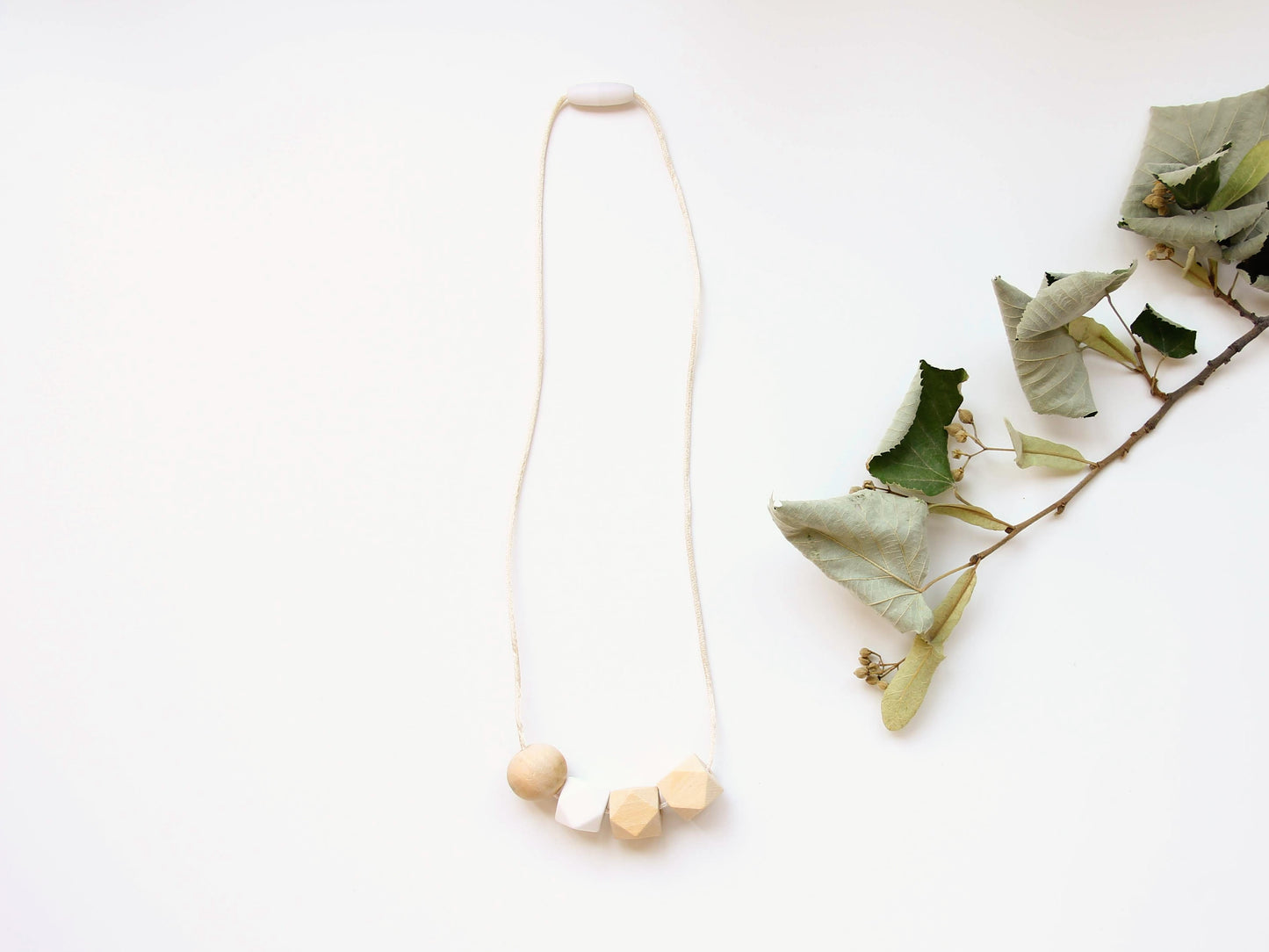 White - Fiddle Teething Necklace in non-toxic wood & silicone