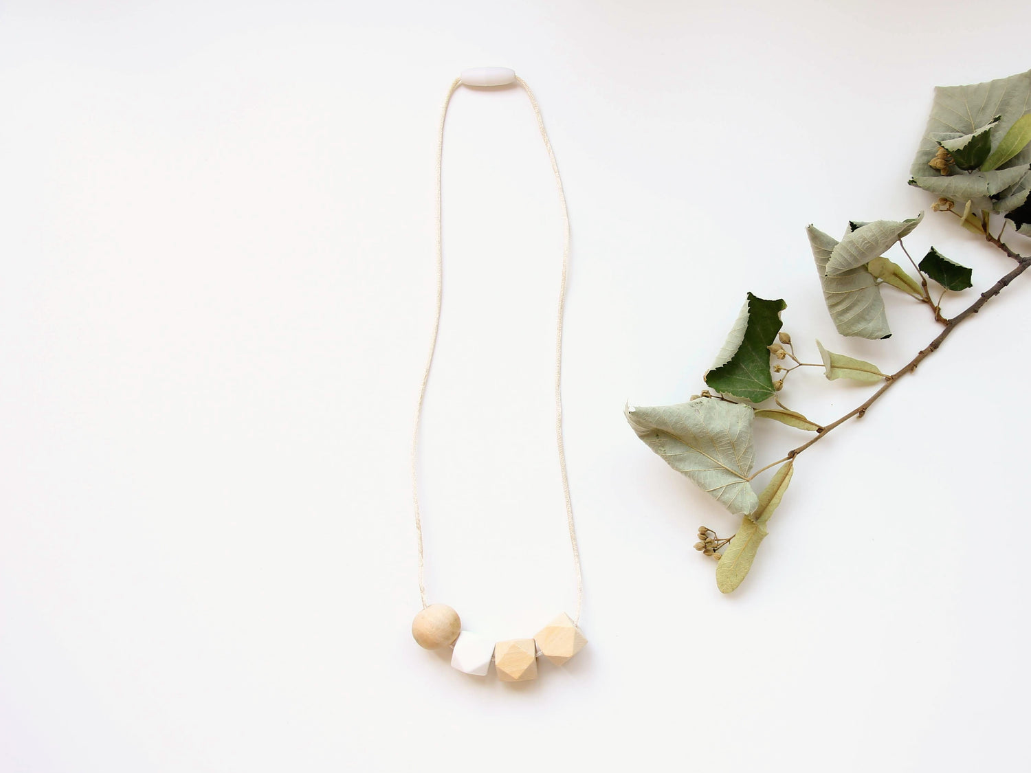 White - Fiddle Teething Necklace in non-toxic wood & silicone