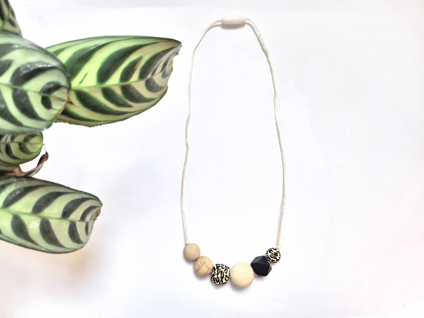 Stylish Nursing necklace Leopard silicone & natural non-toxic wooden beads with white cord from madebyHazel.