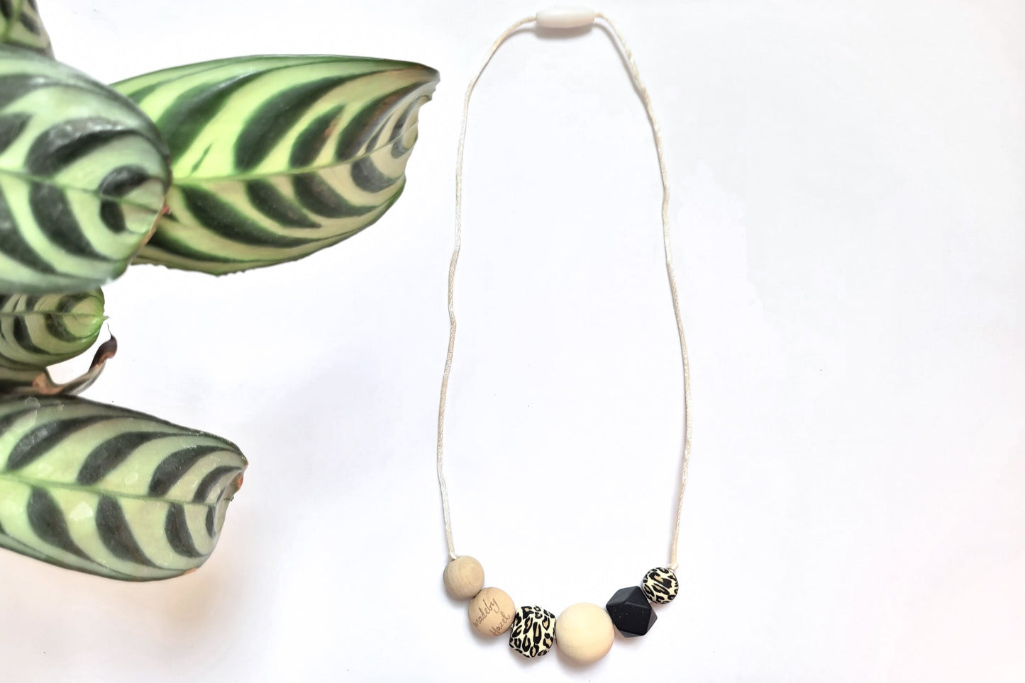 Stylish Nursing necklace Leopard silicone & natural non-toxic wooden beads with white cord from madebyHazel.